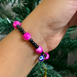 Nazar Suraksha Spiritual Pearl Rakhi – Evil Eye & Vibrant Magenta Devotional Bracelet