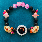 Sacred Harmony Devotional Bracelet – Handcrafted Wristwear with Black Onyx Style Beads, Crystal Pink Accents & Pearl-Framed Deity Centrepiece