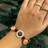 Sacred Harmony Devotional Bracelet – Handcrafted Wristwear with Black Onyx Style Beads, Crystal Pink Accents & Pearl-Framed Deity Centrepiece