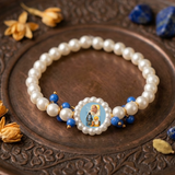 Devotional Pearl Bead Bracelet with Spiritual Centerpiece & Blue Accent Charms