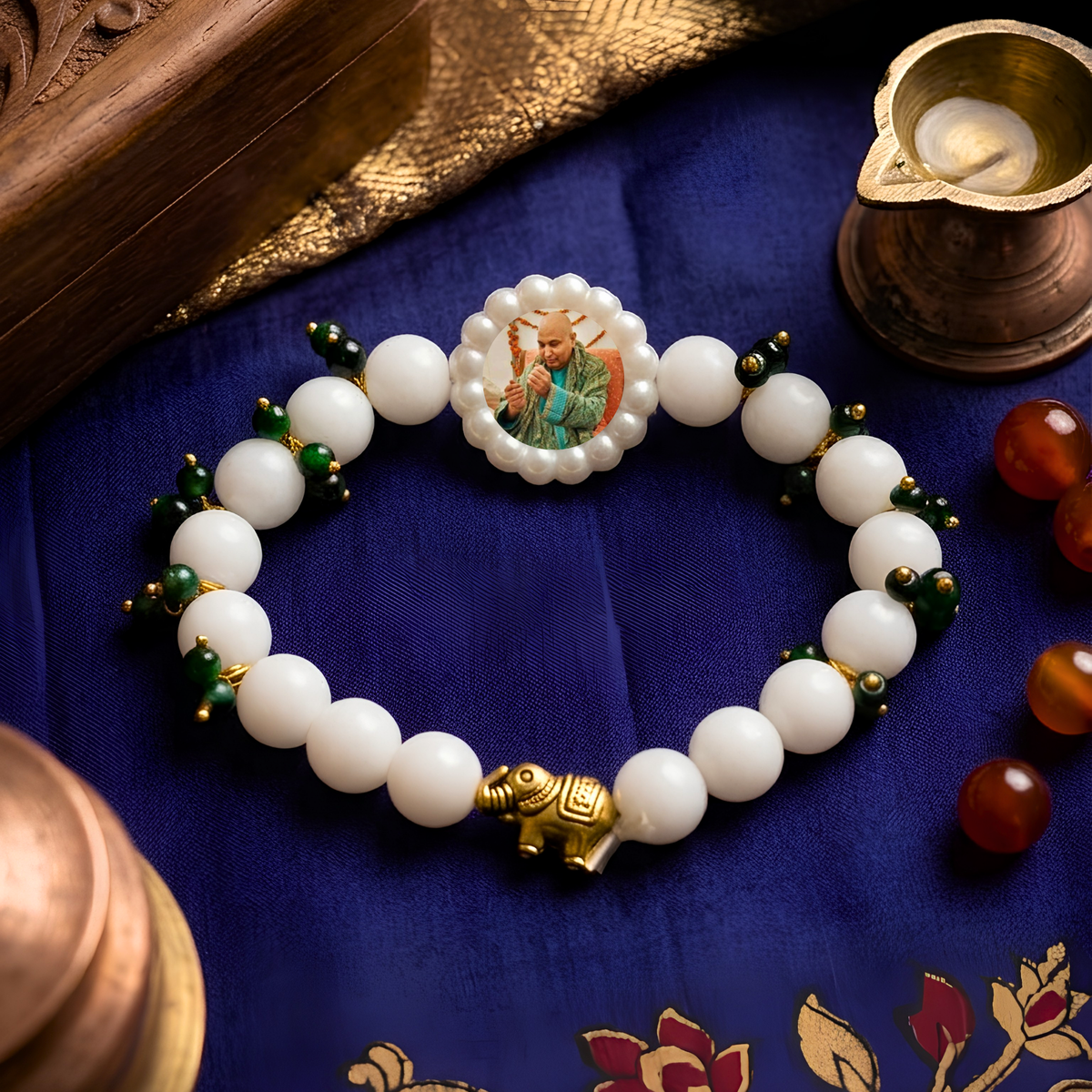 Sacred Elephant & Emerald-Beaded Pearl Rakhi Bracelet – Devotional Guru Commemorative Wristband