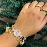 Divine Grace Pearl Rakhi Bracelet – Elegant Devotional Wristwear with Enamel Lotus Elements