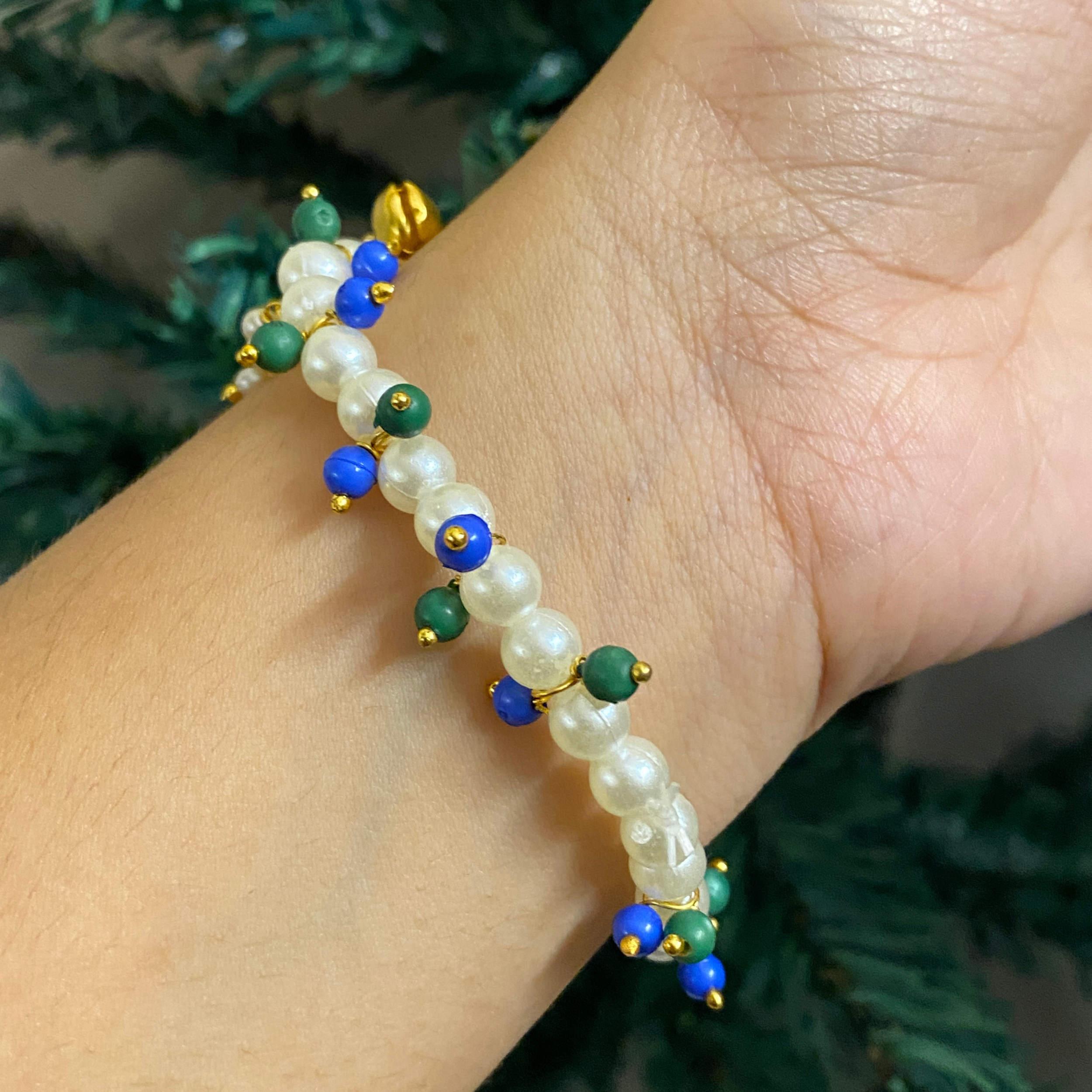 Divine Grace Pearl Rakhi Bracelet – Elegant Devotional Wristwear with Enamel Lotus Elements