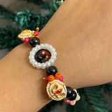 Sacred Harmony Devotional Bracelet – Handcrafted Wristwear with Black Onyx Style Beads, Crystal Pink Accents & Pearl-Framed Deity Centrepiece