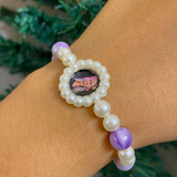 Spiritual Elegance: Lavender Marbled Bead & Pearl Rakhi Bracelet with Divine Guruji Centerpiece