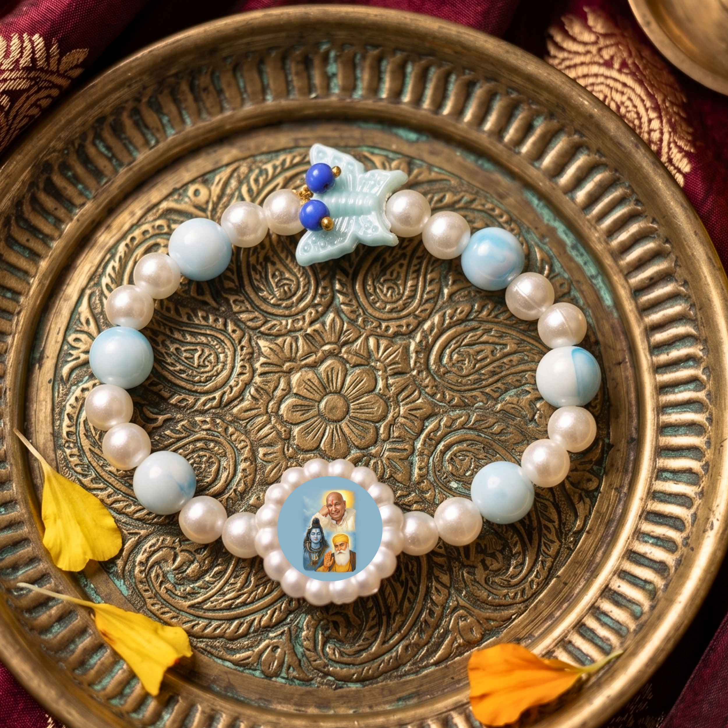 Sacred Grace: Sky Blue Marbled Bead & Pearl Rakhi Bracelet with Divine Deity Centerpiece