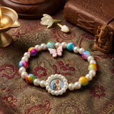 Vibrant Spiritual Pearl Bracelet with Deity Pendant and Butterfly Charm