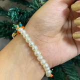 Sacred Embrace Devotional Bracelet – Handcrafted Pearl Wristwear with Meenakari Art Blessing